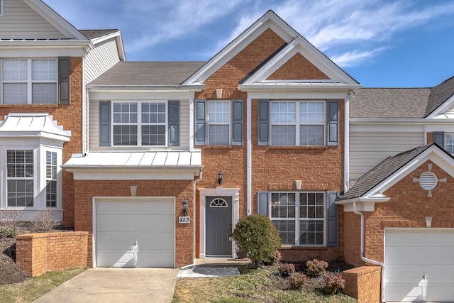 view of front of home featuring brick siding, driveway, and a garage