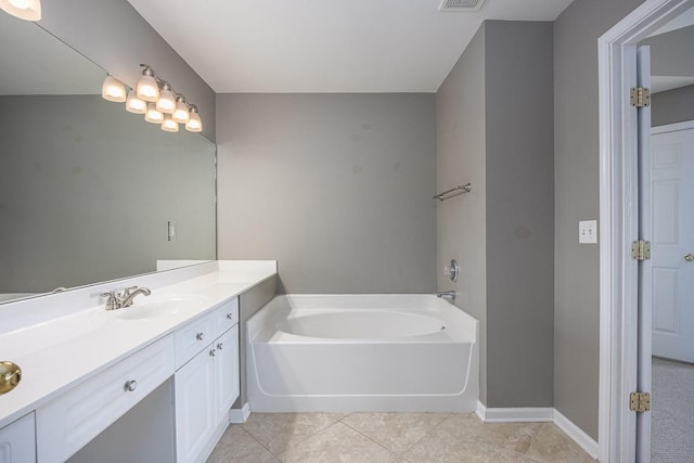 full bath with visible vents, tile patterned flooring, baseboards, a bath, and vanity