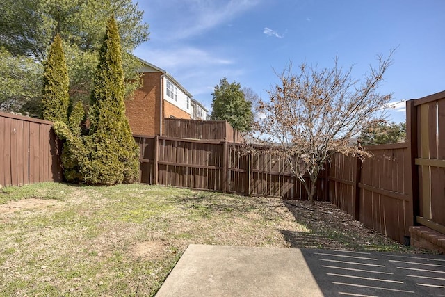 view of yard with a fenced backyard