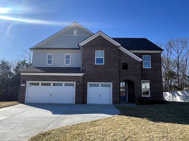 view of front facade featuring an attached garage, brick siding, driveway, roof with shingles, and a front yard