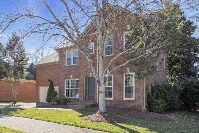 view of front facade featuring a garage and brick siding