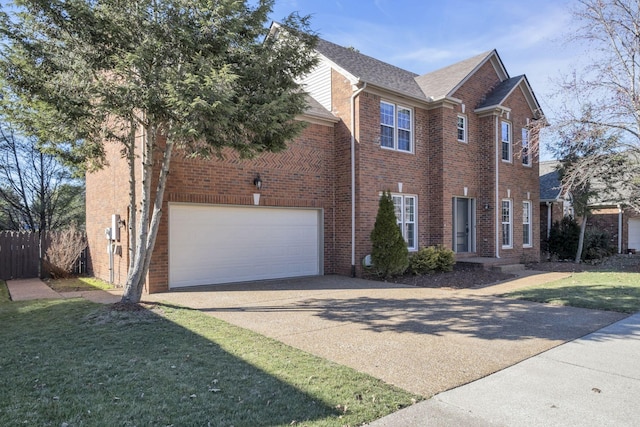 view of front facade with concrete driveway, an attached garage, fence, a front lawn, and brick siding