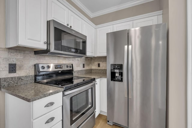 kitchen with tasteful backsplash, white cabinetry, stainless steel appliances, and crown molding