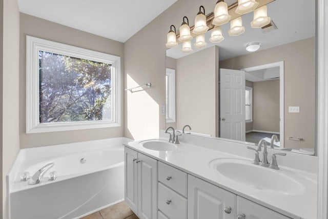 full bath featuring tile patterned flooring, double vanity, a sink, and a bath