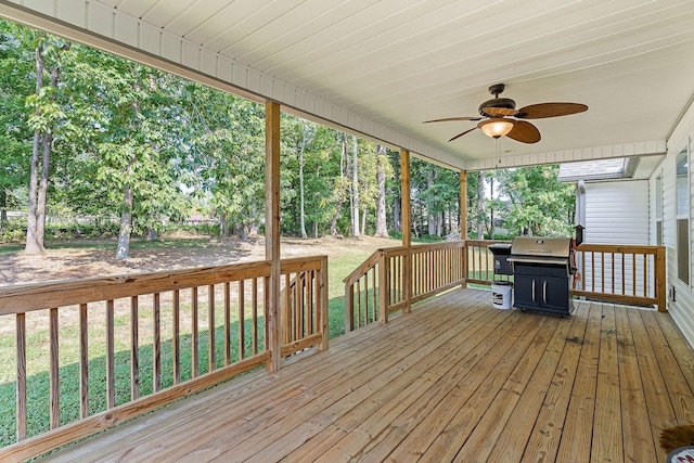 deck featuring ceiling fan and grilling area