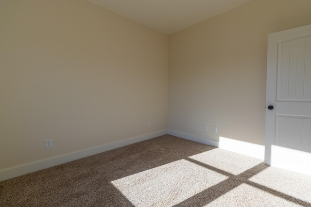 empty room with carpet flooring and baseboards