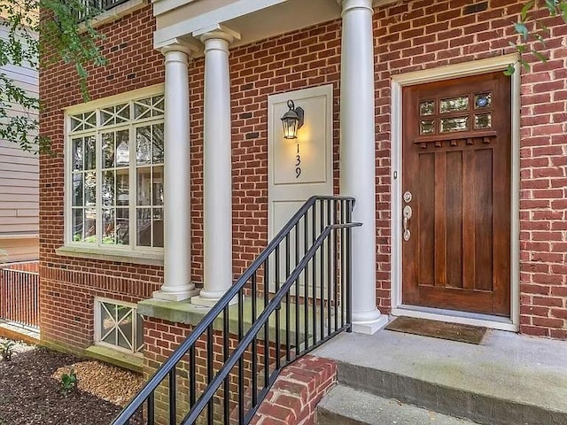 entrance to property with brick siding