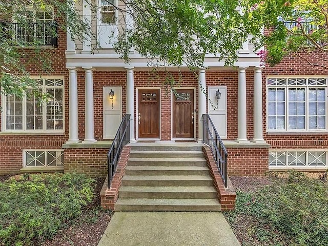 entrance to property with brick siding