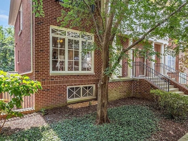 view of side of property with brick siding