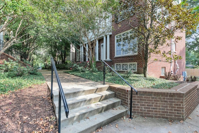 view of front of home featuring brick siding