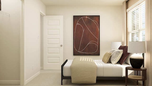 carpeted bedroom featuring multiple windows and baseboards