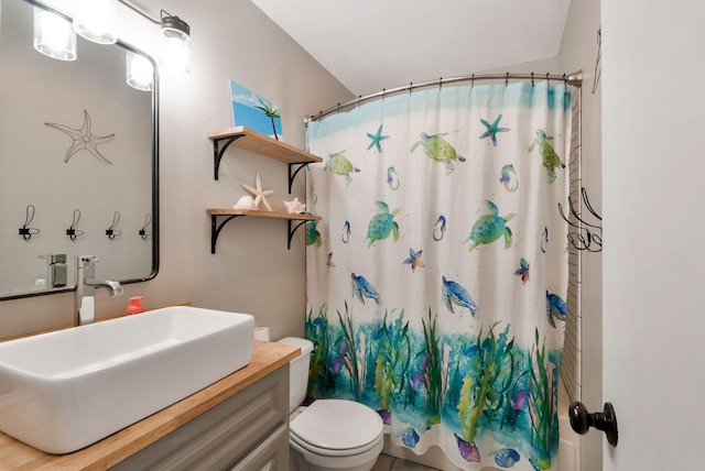 full bathroom with toilet, shower / bathtub combination with curtain, and vanity