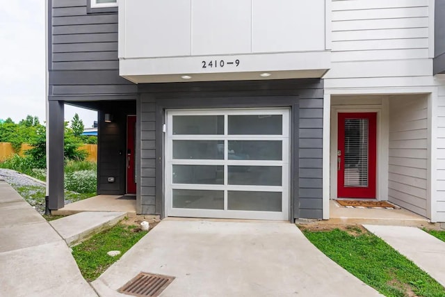 doorway to property featuring a garage