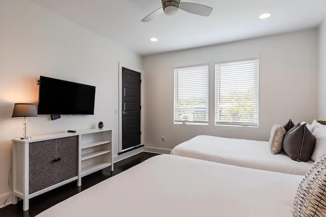 bedroom with dark wood-type flooring, recessed lighting, baseboards, and a ceiling fan