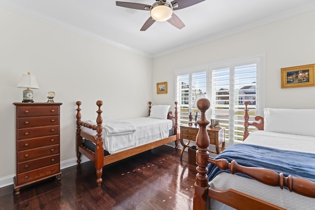 bedroom with a ceiling fan, crown molding, baseboards, and wood finished floors