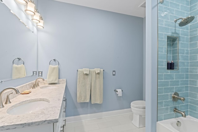 full bathroom with double vanity, baseboards, tub / shower combination, and a sink