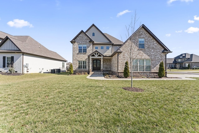 craftsman-style home featuring french doors, brick siding, central AC, and a front lawn