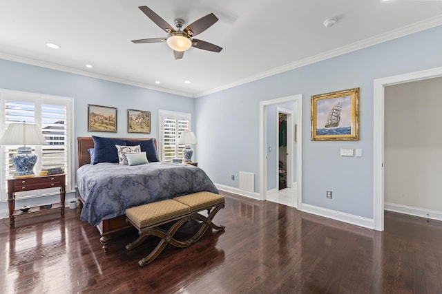 bedroom with multiple windows, wood finished floors, and visible vents