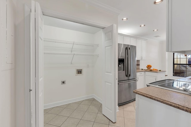 kitchen with light tile patterned floors, recessed lighting, white cabinets, and stainless steel fridge with ice dispenser