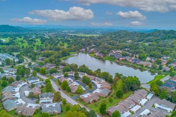 birds eye view of property featuring a water view and a residential view