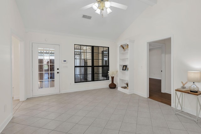 unfurnished room with light tile patterned floors, visible vents, a ceiling fan, vaulted ceiling, and baseboards