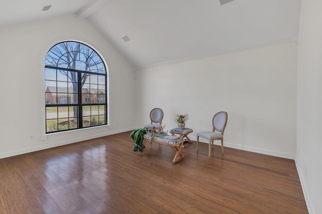 living area featuring visible vents, lofted ceiling with beams, baseboards, and wood finished floors