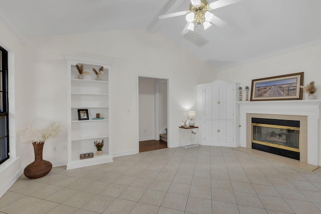 unfurnished living room with vaulted ceiling with beams, light tile patterned floors, and a glass covered fireplace