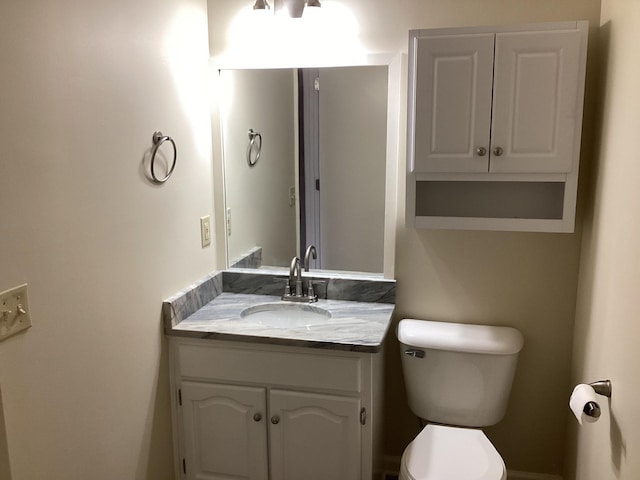 half bath with toilet and vanity