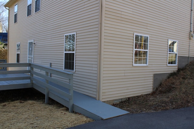 view of side of property featuring a deck