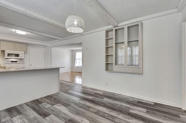 unfurnished living room with a textured ceiling, baseboards, and dark wood-style flooring