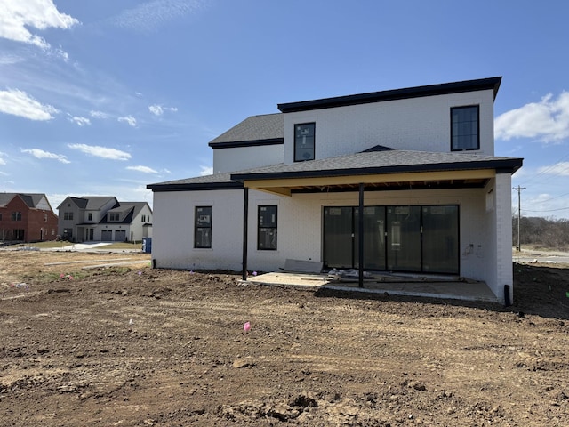 back of property featuring a patio area