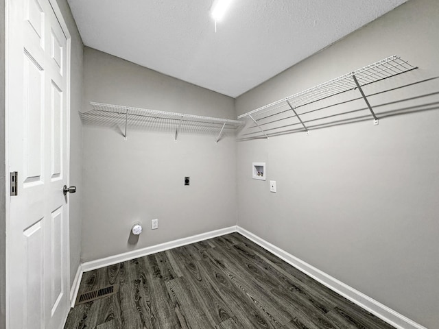 clothes washing area with laundry area, baseboards, dark wood-style floors, hookup for a washing machine, and hookup for an electric dryer