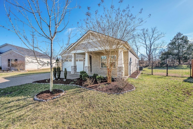 view of front of house with a front yard, fence, and brick siding