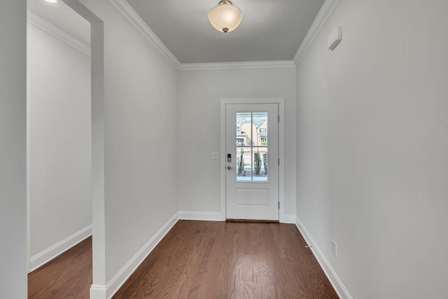 doorway to outside with dark wood-style floors, baseboards, and ornamental molding