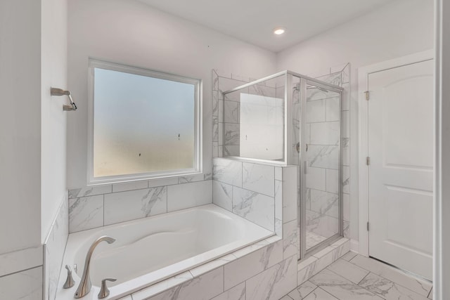 full bath with marble finish floor, a stall shower, a garden tub, and recessed lighting