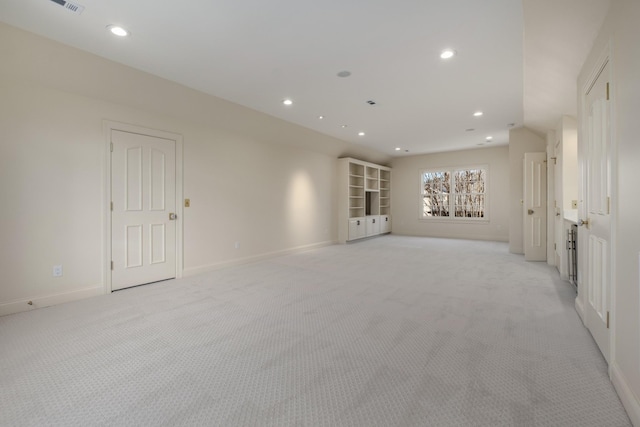 spare room with visible vents, baseboards, light colored carpet, and recessed lighting