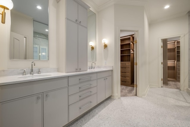 full bath with ornamental molding, a sink, and recessed lighting