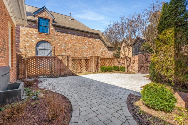 view of patio featuring fence