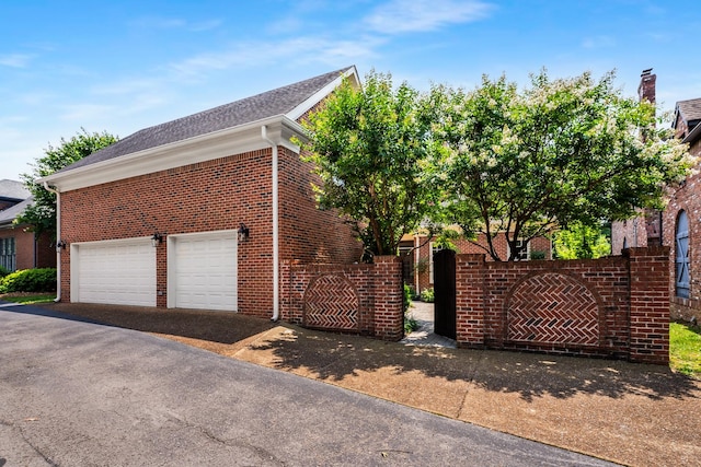 53 Whitworth Blvd, Nashville, TN 37205 - view of property exterior with brick siding, a garage, and driveway