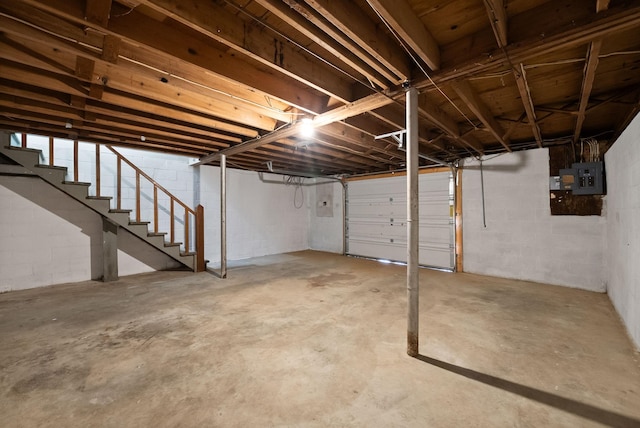 basement featuring stairway and electric panel