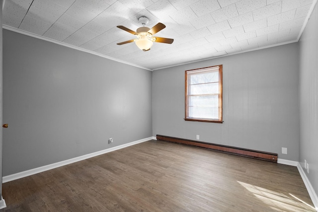 empty room featuring baseboards, a baseboard radiator, wood finished floors, and crown molding