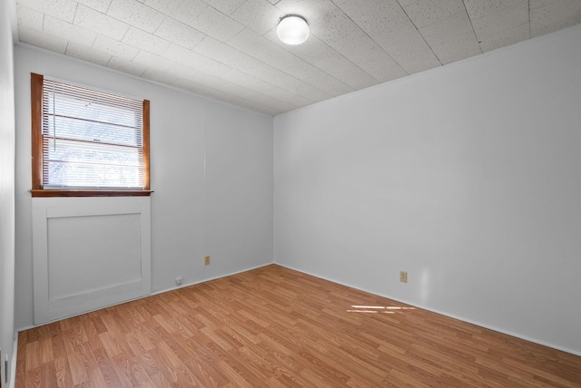 unfurnished room with light wood finished floors