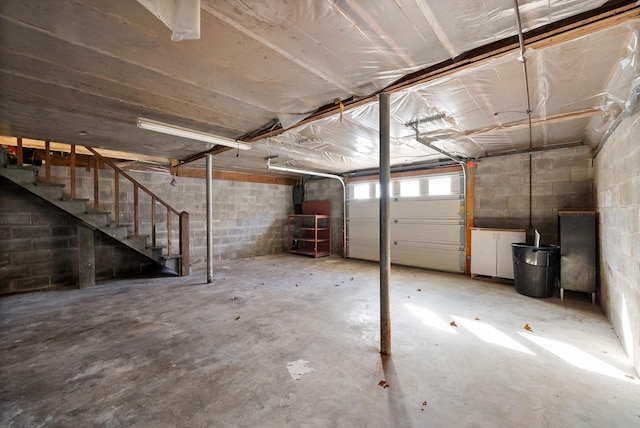 garage featuring concrete block wall