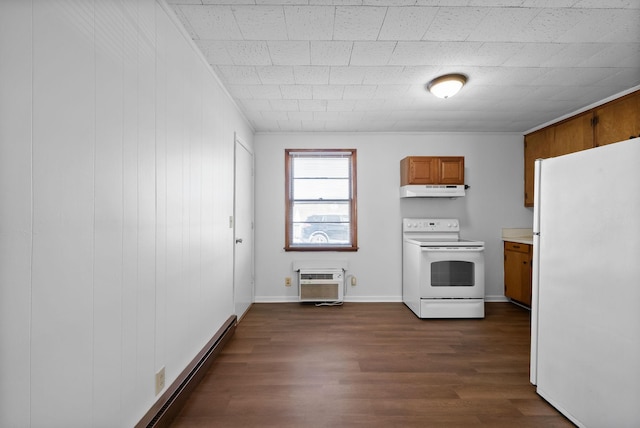 kitchen with dark wood-style flooring, brown cabinets, an AC wall unit, white appliances, and under cabinet range hood