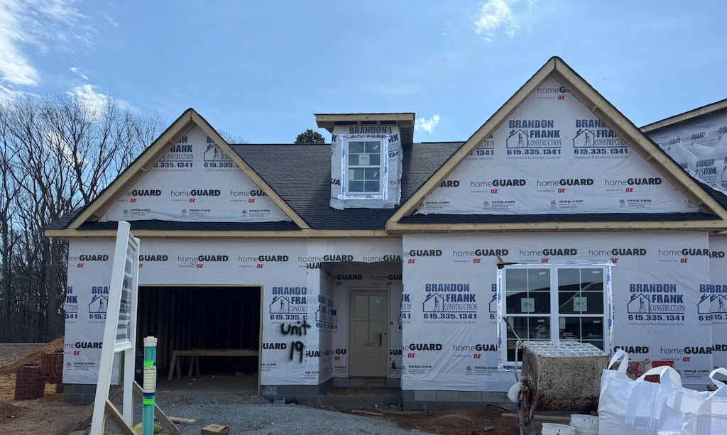 property under construction with an attached garage