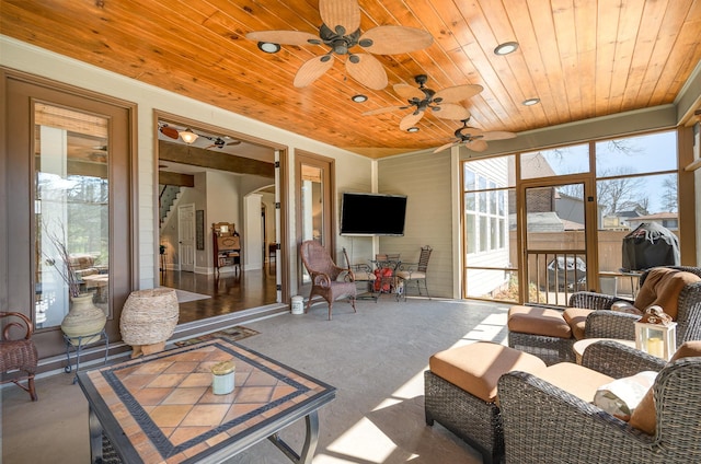 sunroom / solarium featuring wooden ceiling