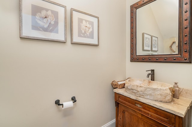 bathroom featuring vanity and baseboards