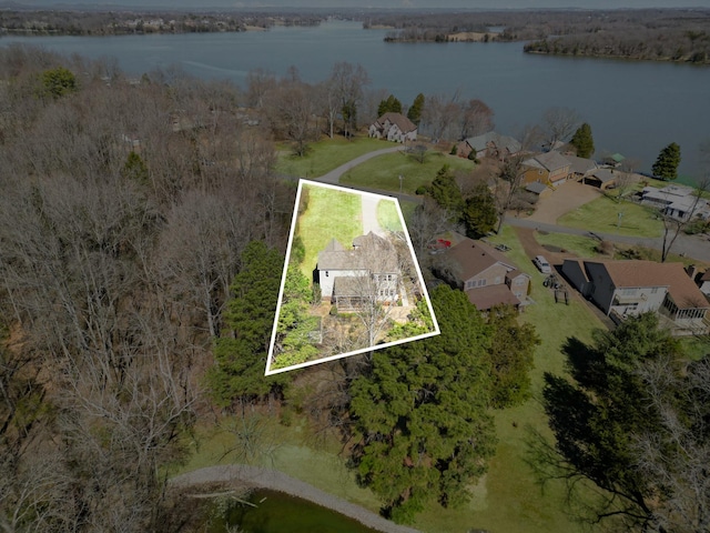 drone / aerial view featuring a water view and a residential view