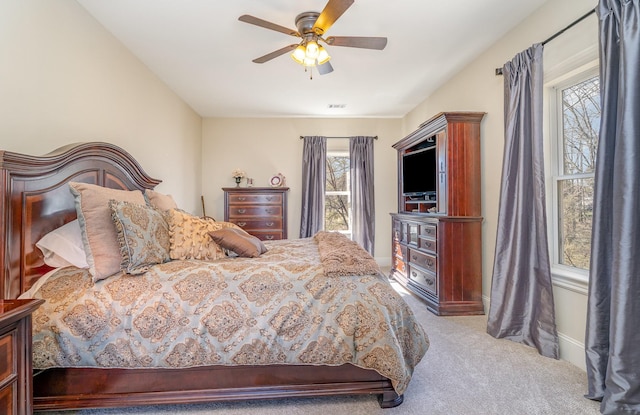 bedroom featuring carpet, visible vents, ceiling fan, and baseboards