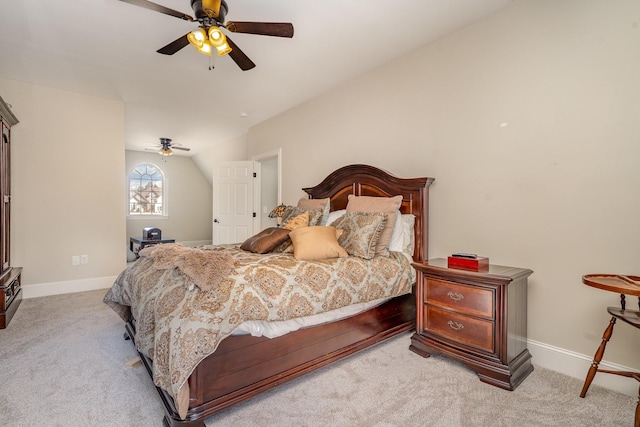 bedroom with light carpet, ceiling fan, lofted ceiling, and baseboards